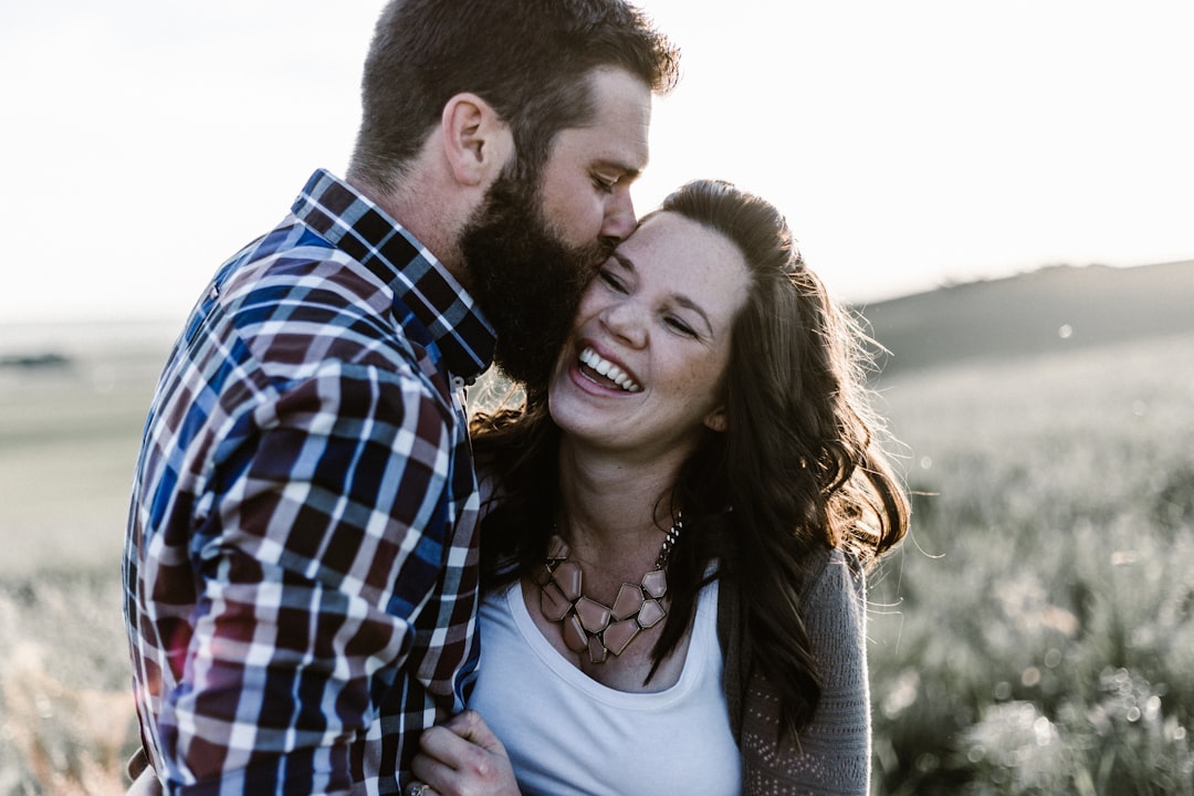 Photo by Priscilla Du Preez ???????? man kissing woman in grass area